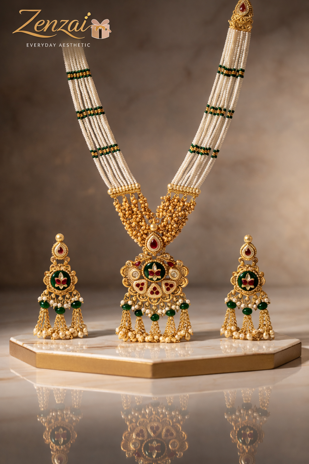 Traditional Zenzai temple jewellery set featuring long pearl strands, floral gold pendant and coordinated earrings