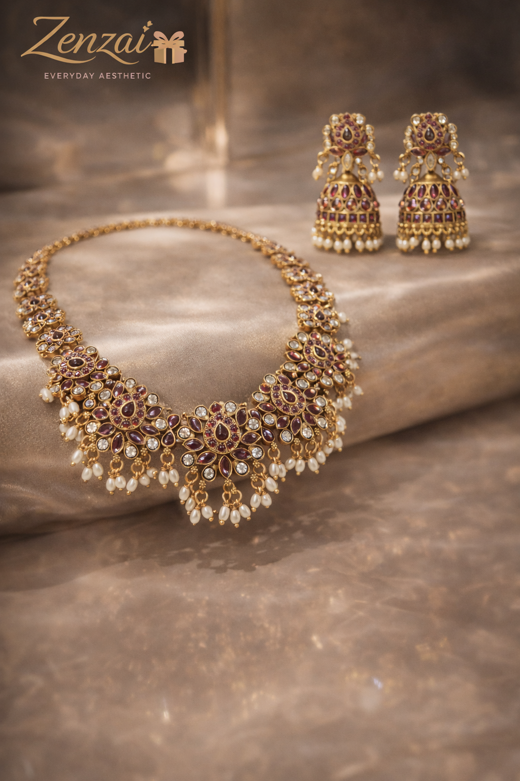 Zenzai pearl necklace set with maroon stones, scalloped gold design and cascading pearl strands