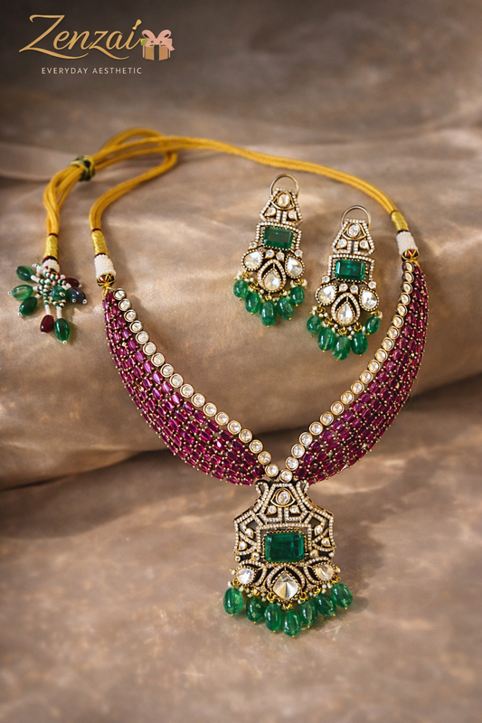 Zenzai ruby and emerald polki necklace set with V-shaped choker design, geometric pendant and matching green drop earrings